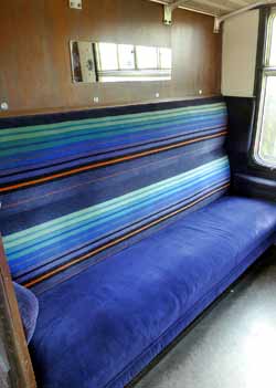 Inside standard class compartment blue seats British Mk1 train.