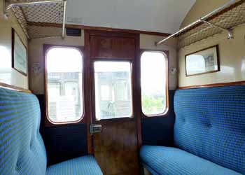 inside non-corridor compartment railway carriage.