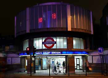Nocturnal illumination of Warwick Road Entrance Earls Court station.