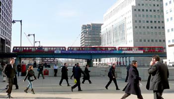 triple unit London DLR train on bridge.