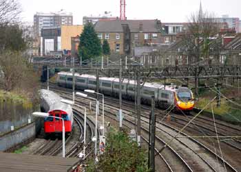 Route sharing Bakerloo Line and Virgin Pendolino Tilting Train At Kensal Green.