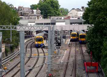 Three Overground trains at Highbury and Islington station.