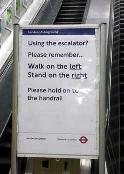 Walk left stand right escalator sign.