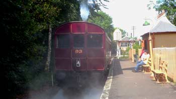  Much visible steamas GWR Railmotor departs from station.