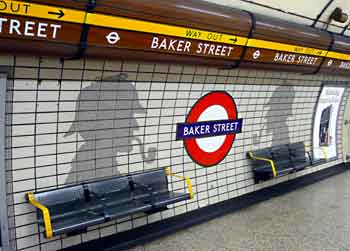 Large silhouettes of Sherlock Holmes on Bakerloo line platform at Baker Street station.