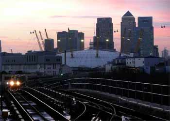 London Docklands Tower Buildings Cable Car DLR train At Sunset.