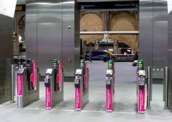 open ticket gates at a railway station.