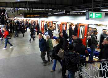 Westbound S stock underground train at Liverpool Street station subsurface platform.