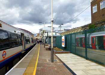 West Brompton platform with wire mesh fence.