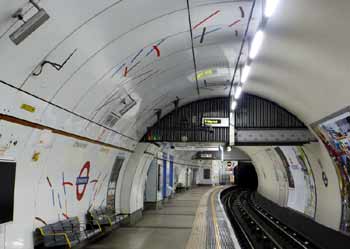 Vitreous enamel platform wall cladding Embankment station.