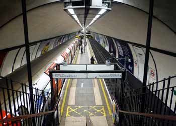 Northern line very narrow platform in single tube tunnel.