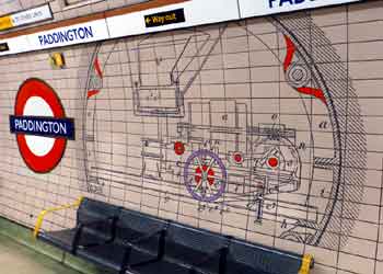 Brunel tunnel shield tile mural on tube station platform wall.