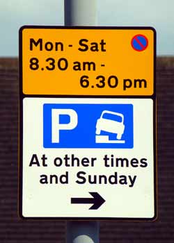 End of permitted to park with one side of vehicle on kerb road sign.