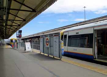 London Overground trains at Clapham Junction station seen from platform 3.