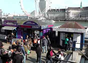 Tourists buying river cruise tickets in Westminster.