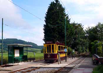 Tram No.16 departs from Colyford Junction.