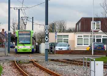 Tramlink tram passing Medical centre New Addington.