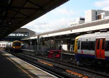 London Overground trains at Clapham Junction station.