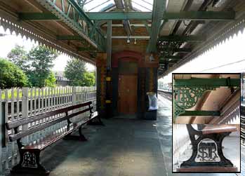 railway station platform with historic metal seat scrollwork.