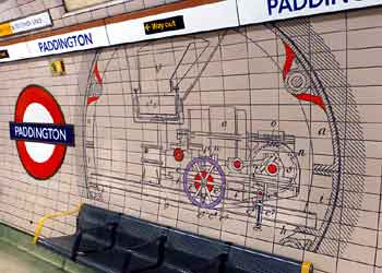 Brunel tunnel shield tile mural on tube station platform wall.