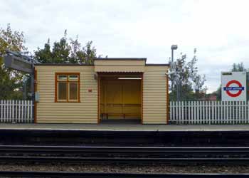East Acton station - wooden platform shelter outside.