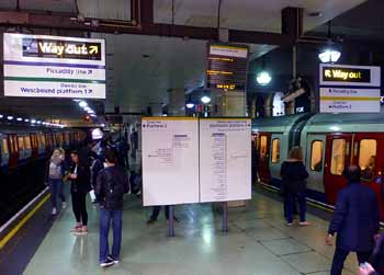 two trains at Gloucester Road subsurface.