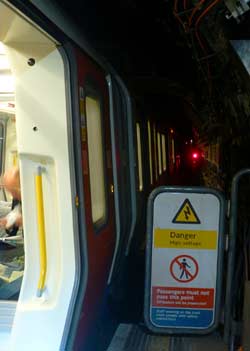 Baker Street Station short platform train partly in tunnel.