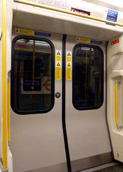Inside train at Baker Street Station short platform doors closed.
