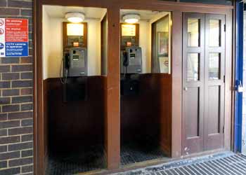 Telephones booths at Arnos Grove station.