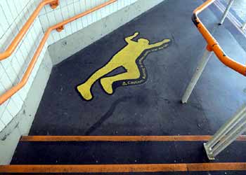 Pictogram of person on stairway landing at West Croydon station.