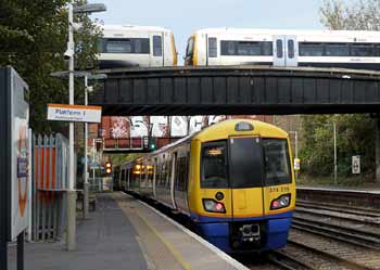 Overground and SouthEastern trains at Brockley station.