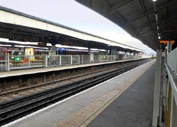 Tram And Underground Train At Wimbledon station.