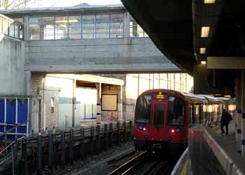 Acton Town station District line train closed platform.