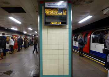 District and Central line trains at Mile End station.