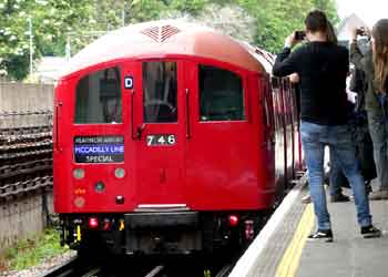 passengers taking a photograph of a train.