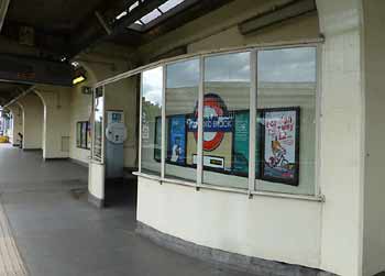 sheltered waiting area on Art Deco platform at Stamford Brook station.