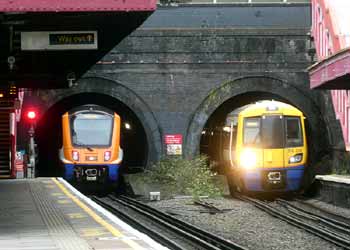 London Overground Classes 710 and 378 trains Kensal Green tunnel mouths.
