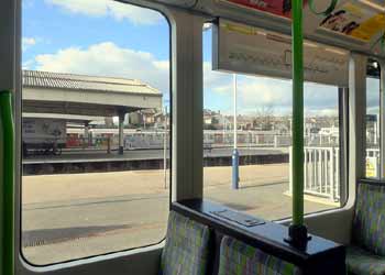 Wimbledon station underground train seen trom tram.