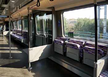Class 345 train inside tip up seating wheelchair bay.