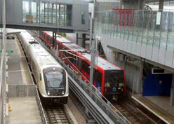 Elizabeth line DLR trains Custom House station.
