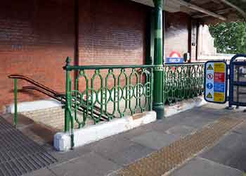 Historic stairway railings Fairlop station.