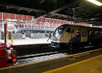 Elizabeth line train at Paddington National Rail station.