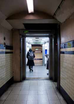 Lift with doors open at both ends at Mornington Crescent underground station