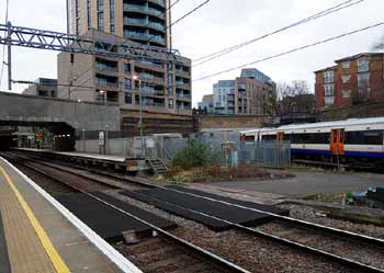 East London Windrush line train passes Dalston Kingsland station.
