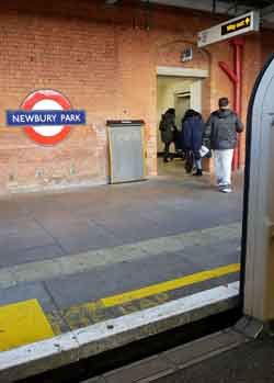looking towards an accessibility lift as seen from inside a train at Newbury Park railway station.