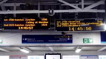 London Overground next train displays at Clapham Junction station.