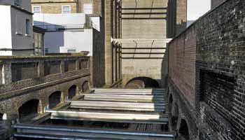 view of railway from above a high wall.