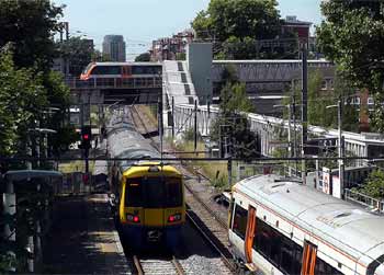 London Overground trains pass near Hackney Central / Hackney Downs.