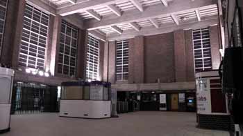 Inside Oakwood station ticket hall at night.