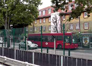 Bus calling at bus stop outside West Ham station.